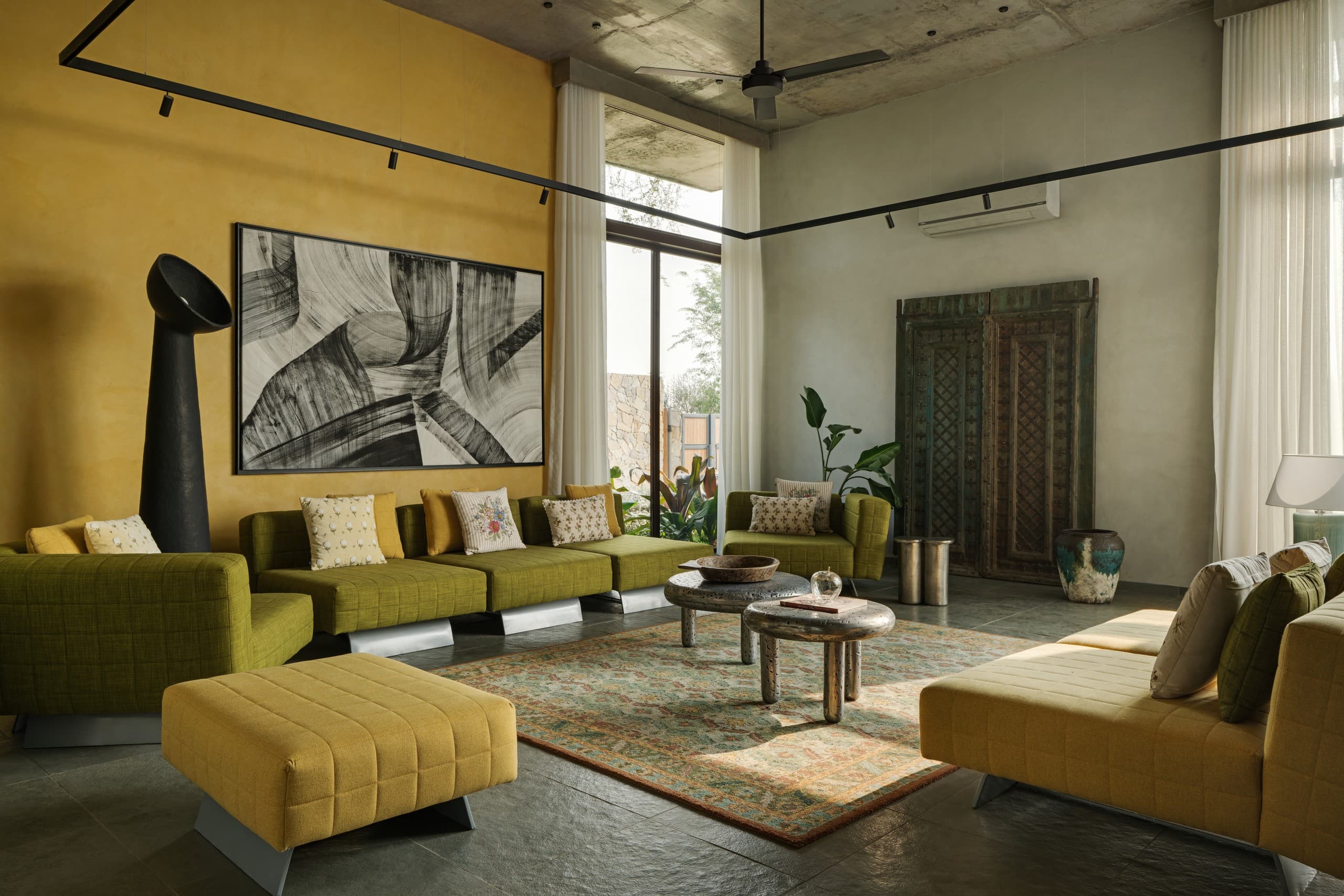 The living room at SAHN opens fully to the courtyard.